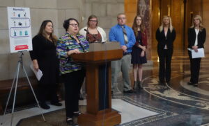 State Senator Kathy Campbell (at podium)