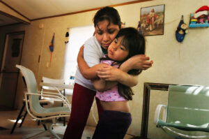 After less than a year working in poultry, Karina Zorita was unable to use her hands for a hug, straighten her fingers, or grab a spoon. Photo by John D. Simmons/The Charlotte Observer